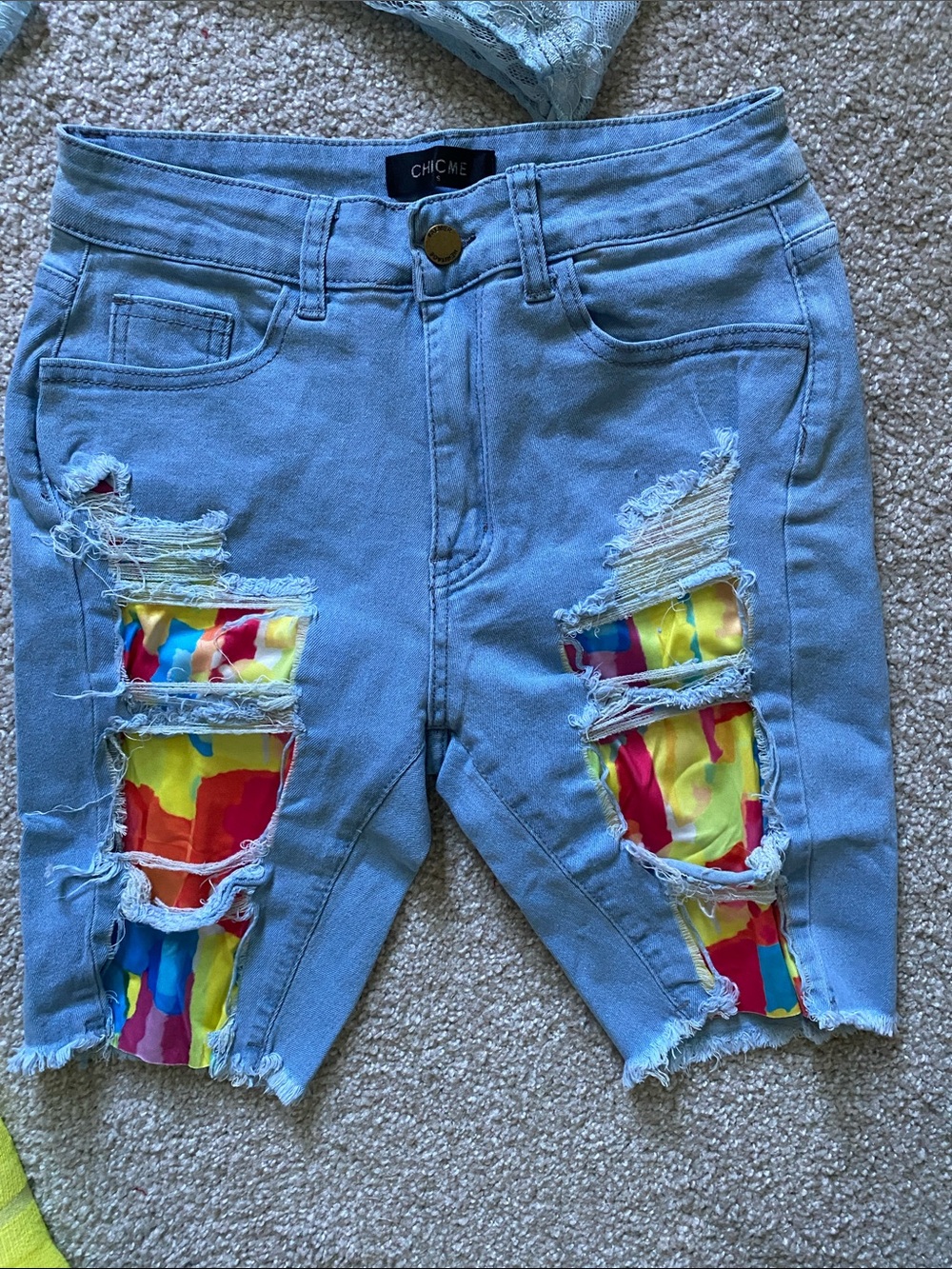 chic Light Blue Distressed Denim Shorts with Rainbow Patch Insets